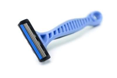 Close up of blue shaver on white background